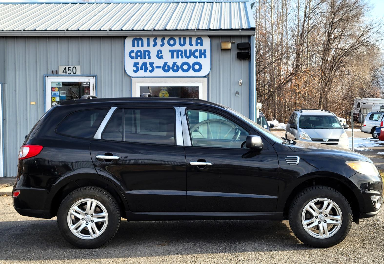 2012 Black /Tan Hyundai Santa Fe Premium (5XYZGDAB1CG) with an 2.4L I4 engine, 8 Speed Automatic transmission, located at 450 N Russell, Missoula, MT, 59801, (406) 543-6600, 46.874496, -114.017433 - Photo#1